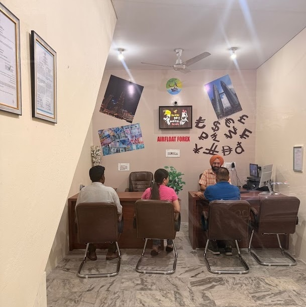 Inside the Airfloat Forex branch at Sainik Colony, Jammu — staff assisting customers